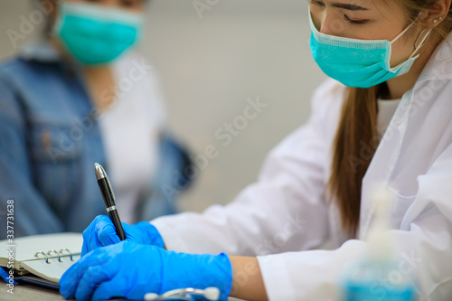 Female Asian pediatrician hold stethoscope exam girl patient visit doctor in the clinic