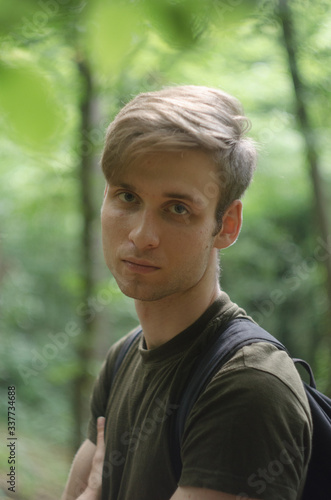 portrait of young man in the forest