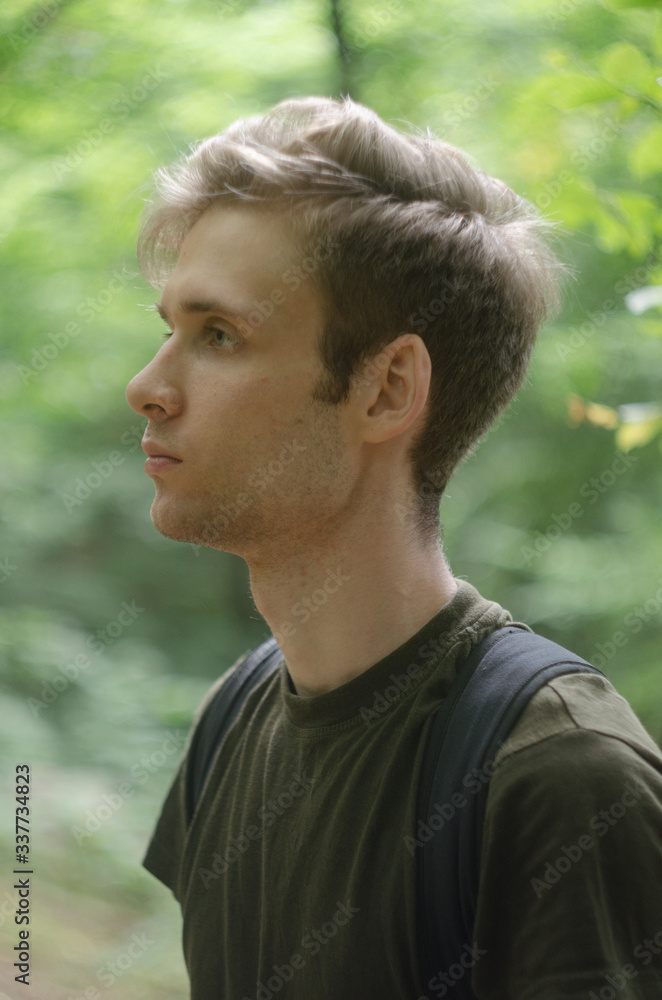 portrait of young man in the forest portrait of young man in the forest