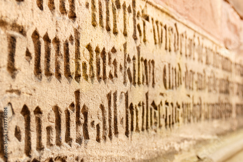 Freiburg im Breisgau, Baden-Wuerttemberg, Germany. Detail of the scriptures on the walls of the cathedral photo