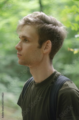 portrait of young man in the forest