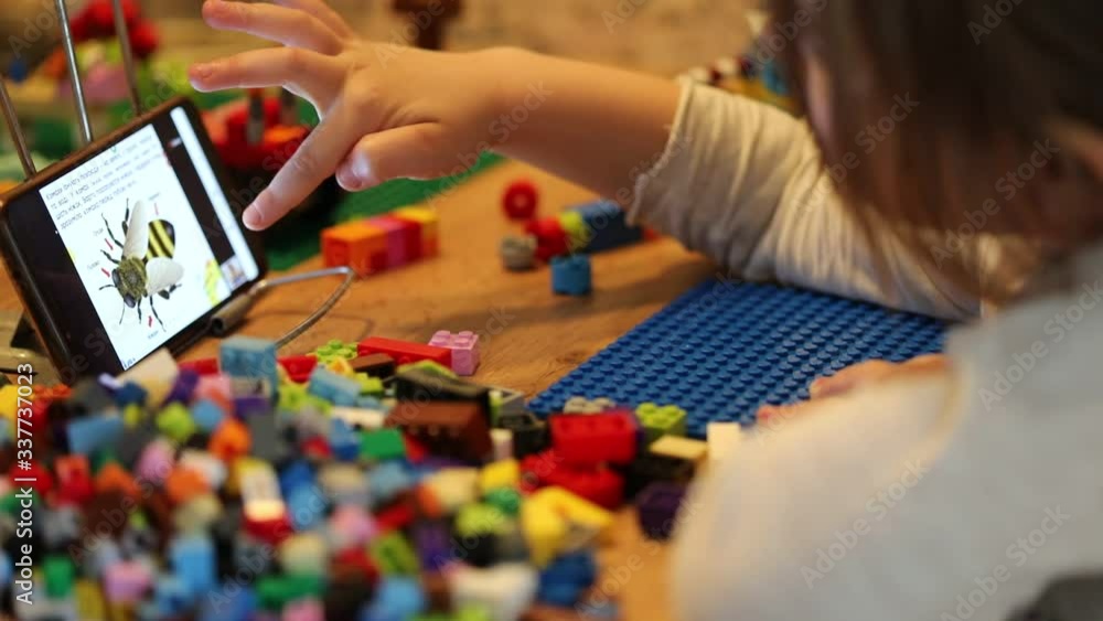Little girl online learning and creating at home. Quarantine and Social distancing concept. Little girl online learning and creating at home. Quarantine and Social distancing concept.