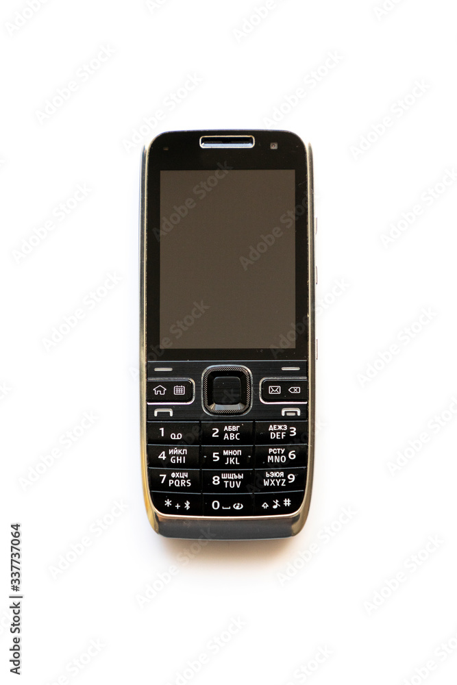 Old cell phone on the white background Old cell phone on the white background