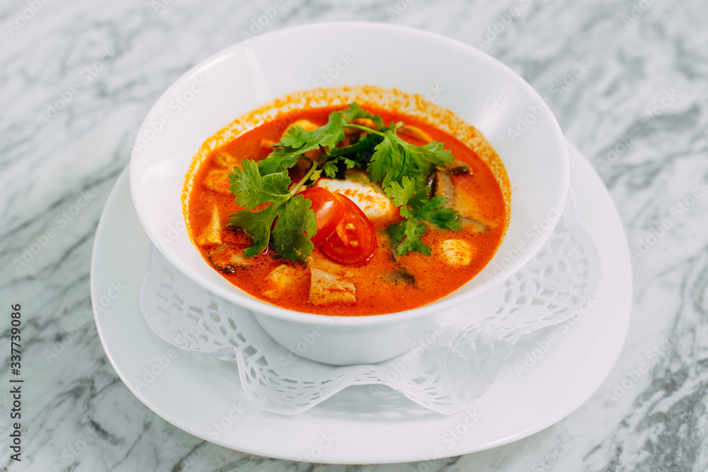 vietnamese spicy tom yam soup on a marble table