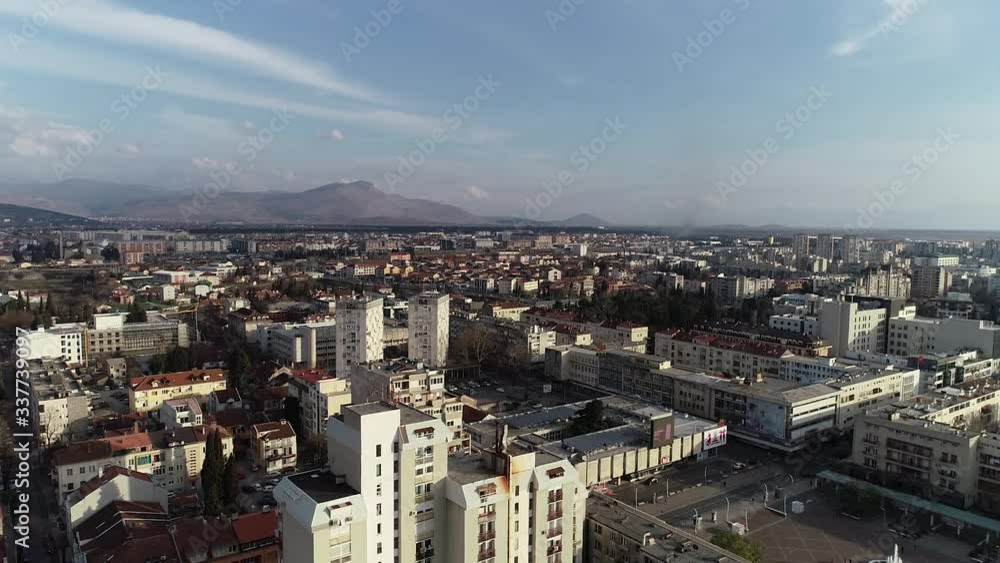 Aerial shot of central Podgorica city, capital of Montenegro. Sunny and bright day with a blue sky. Aerial shot of central Podgorica city, capital of Montenegro. Sunny and bright day with a blue sky.
