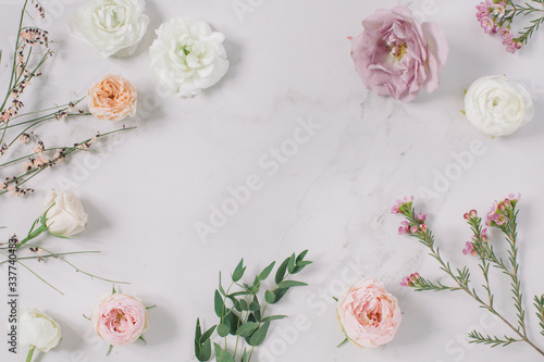 Empty white paper blank, flower buds, branches on beige background. Wedding branding mock up,  holiday marketing concept. © Nina