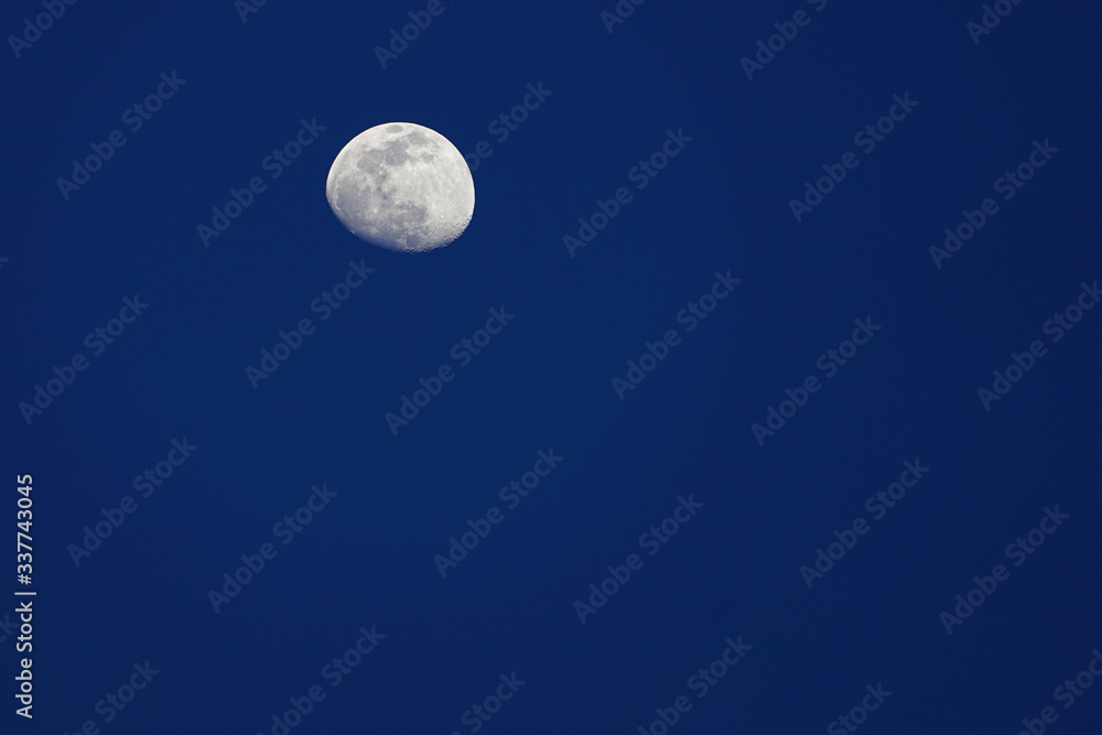 View of the moon and its craters over a dark night sky View of the moon and its craters over a dark night sky