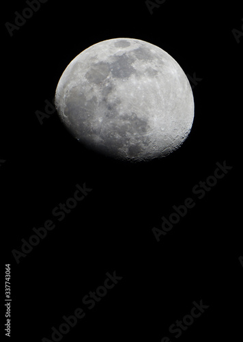 View of the moon and its craters over a dark night sky