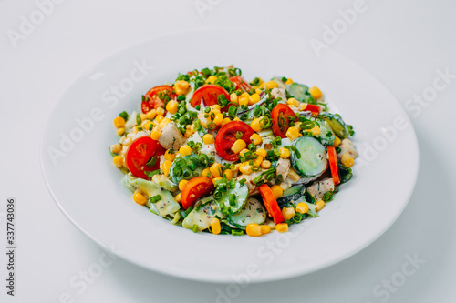 sweet corn, tomato and chicken salad, healthy food isolated on white background