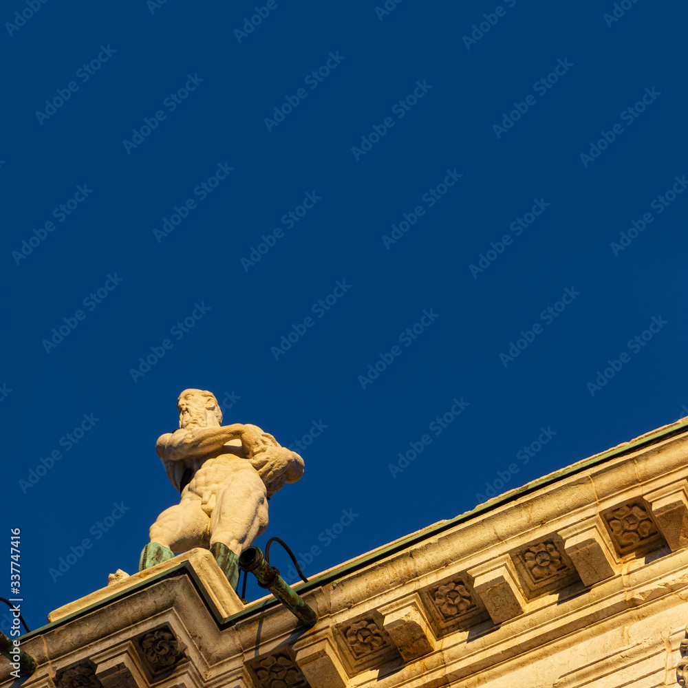 Obraz premium Lower view of the Ionic-inspired entablature of the Palladian Basilica illuminated by the last ray of sunshine. The building was designed by the architect Andrea Palladio in 1546, Vicenza, Italy.