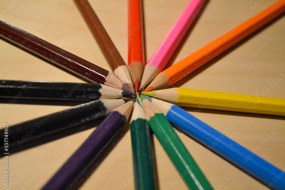 Pencil color set in circle on a wooden table Pencil color set in circle on a wooden table