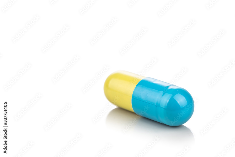 Close-up of medicine in capsule format on white background Close-up of medicine in capsule format on white background