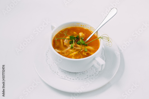 homemade chicken noodle soup isolated on a white background