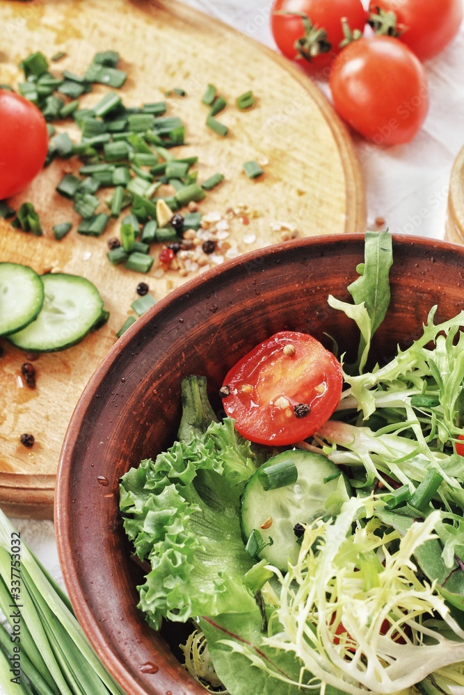 Dietary food background: vegetable salad with cherry tomatoes and cucumbers, vegan cuisine