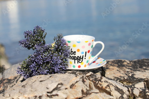 cup of coffee with lavenders on the coast