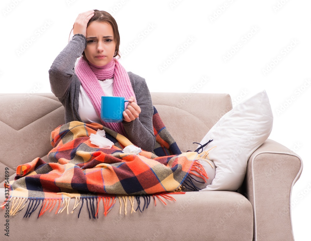 Obraz premium Young woman drinking tea during fever