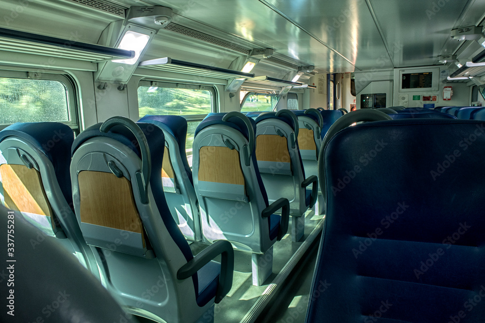 Fototapeta premium View inside the carriage of a passenger train on the railway. Railway transport. 