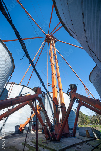 Large silo facility with pumps, conectors, chambers and stairs photo