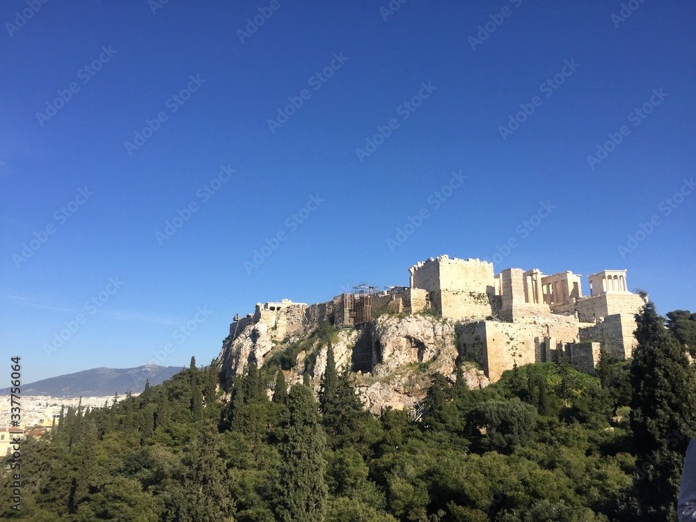 Athens, Greece - 14th April 2018: City View and Scenery of the Acropolis in Athens, Greece. The Acropolis of Athens is an ancient citadel located on a rocky outcrop above the city of Athens