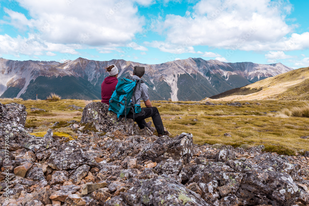 Fototapeta premium Couple hiking in the mountains