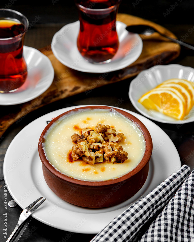 turkish dessert sutlach garnished with walnut turkish dessert sutlach garnished with walnut