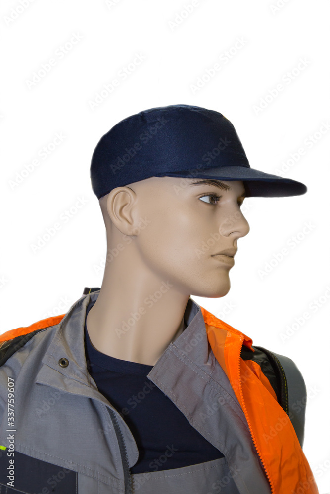 A mannequin of a worker dressed in a blue cap and overalls of gray orange color isolated on a white background, labor protection, protective equipment. A mannequin of a worker dressed in a blue cap and overalls of gray orange color isolated on a white background, labor protection, protective equipment.