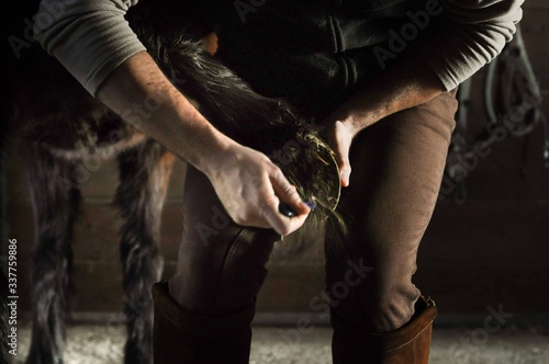 horse hoof cleaning hooves put out dirt by horse breeder jockey