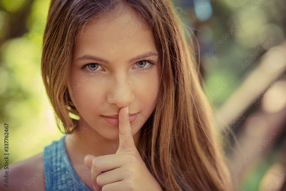 Shh. Woman wide eyed asking for silence secrecy with finger on lips hush hand gesture green park outdoor background Pretty girl placing fingers on lips sign symbol. Negative emotion facial expression Shh. Woman wide eyed asking for silence secrecy with finger on lips hush hand gesture green park outdoor background Pretty girl placing fingers on lips sign symbol. Negative emotion facial expression