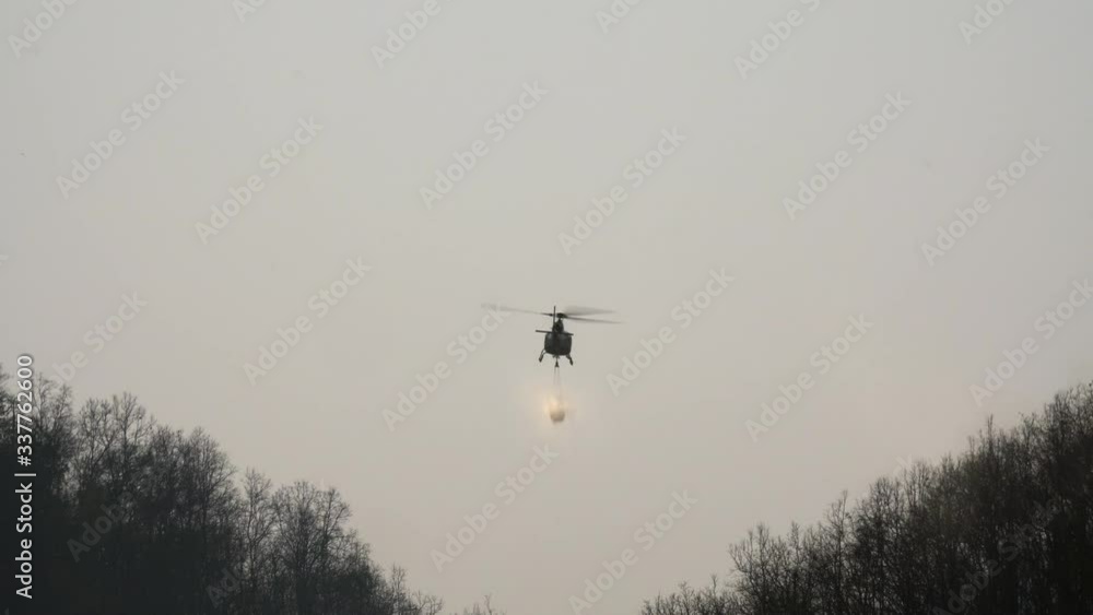 Helicopter carry water bucket for forest fire Helicopter carry water bucket for forest fire