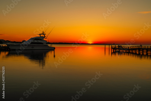 Fototapeta Naklejka Na Ścianę i Meble -  Sunset over Choctawhatchee Bay, Village of Baytowne Wharf, Sandestin, Florida

