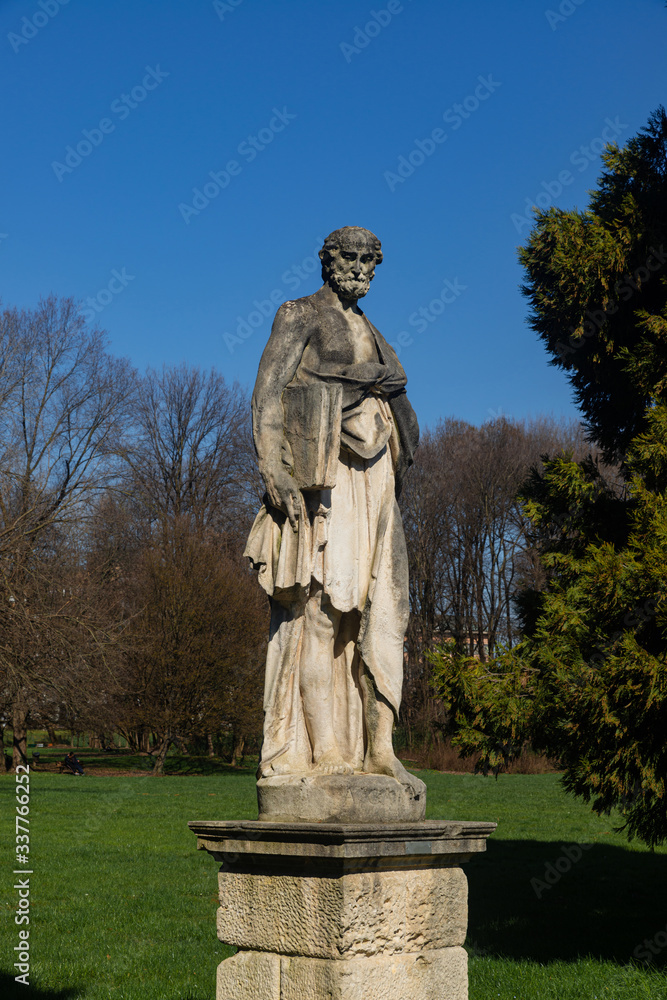 Soft stone statue exposed at Parco Querini, the largest public park in the city of Vicenza. The sculpture probably represents a philosopher from classical Greece and was made between 1600 and 1700.