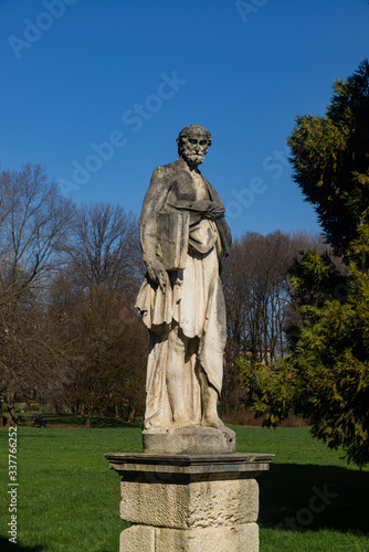 Soft stone statue exposed at Parco Querini, the largest public park in the city of Vicenza. The sculpture probably represents a philosopher from classical Greece and was made between 1600 and 1700.