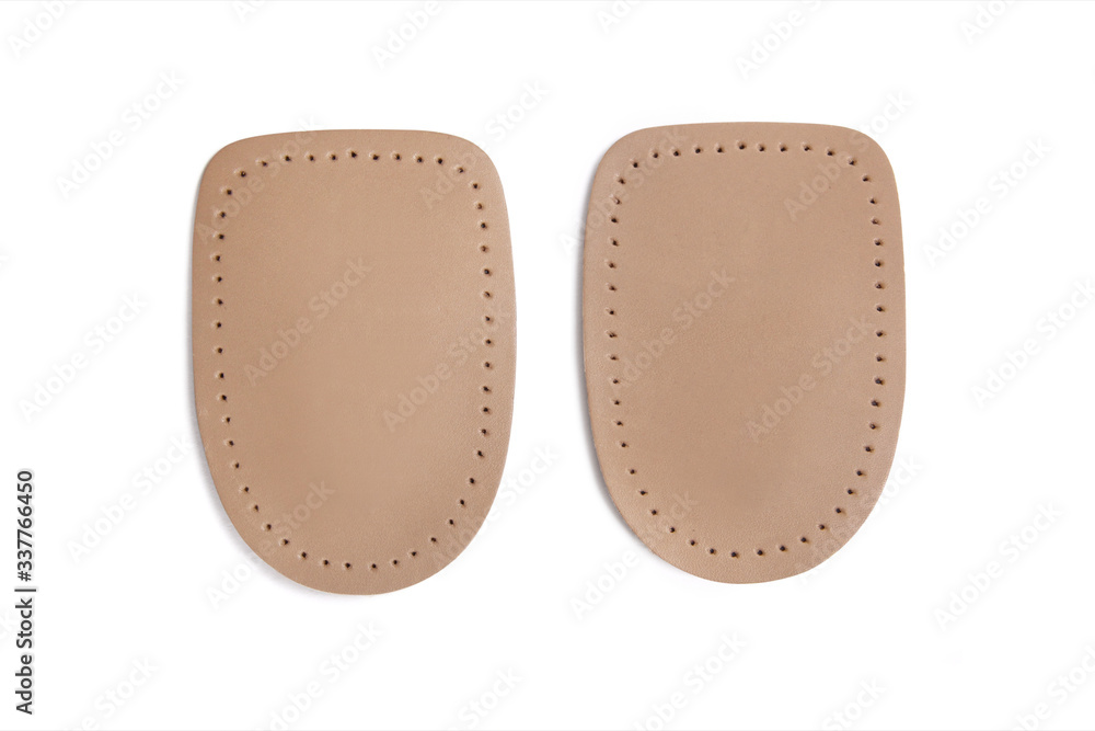 Orthopedic silicone heel pad from corns for the correction of different lengths of legs isolated on white background. Silicone insert for the forefoot. Insole. Silicone thumb protector with interdigit Orthopedic silicone heel pad from corns for the correction of different lengths of legs isolated on white background. Silicone insert for the forefoot. Insole. Silicone thumb protector with interdigit