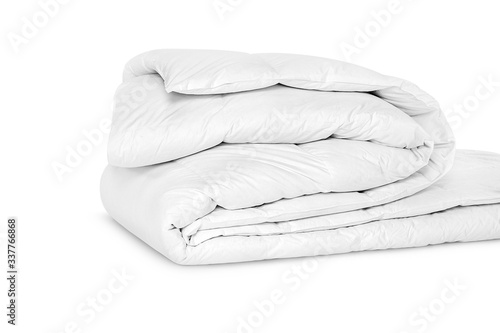 Folded soft white blanket, bedspread or duvet for a comfortable sleep. White blanket folded on a white background. Fabric structure. 3D blanket model. Comfortable sleep. Close up photo photo