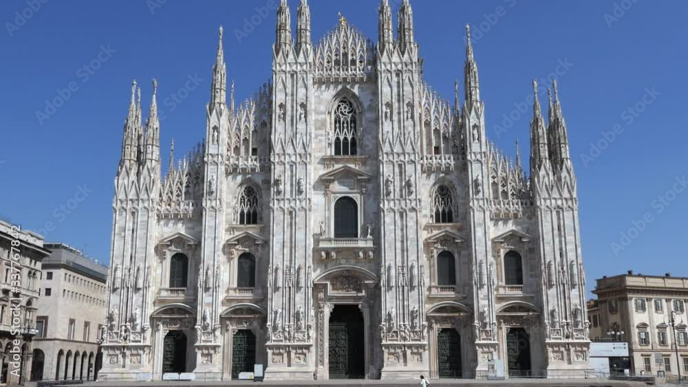 Urban view of empty Duomo square in Milan, Italy during COVID-19 pandemic, with church on sunny springtime day. Everyday life in Milano, Italian city with coronavirus emergency Urban view of empty Duomo square in Milan, Italy during COVID-19 pandemic, with church on sunny springtime day. Everyday life in Milano, Italian city with coronavirus emergency