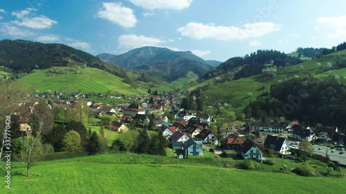 View from above to the small village Münstertal in the Black Forest with the mountain Belchen in the background photo