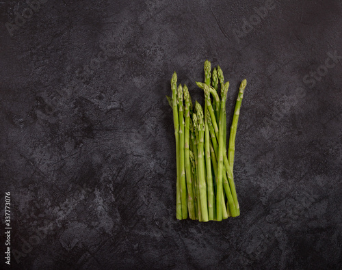 Copy space with asparagus at dark concrete background