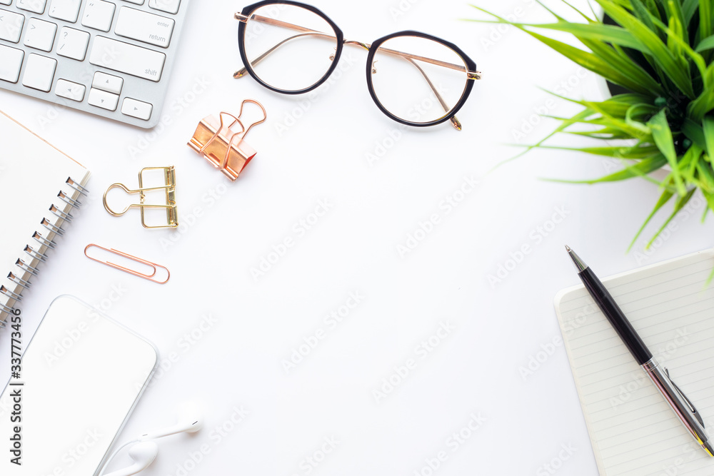 Top view of office desk table with modern accessories.flat lay design.business and technology concepts Top view of office desk table with modern accessories.flat lay design.business and technology concepts