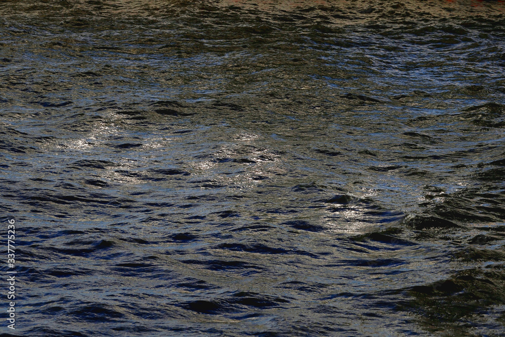 Water surface in the light of the setting sun Water surface in the light of the setting sun