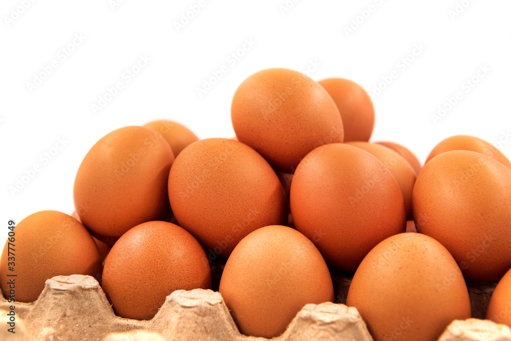 Chicken eggs on a white background in an organic box Chicken eggs on a white background in an organic box
