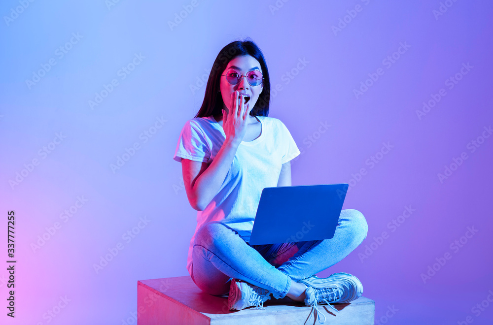 Girl laptop closed her mouth with hand Girl laptop closed her mouth with hand