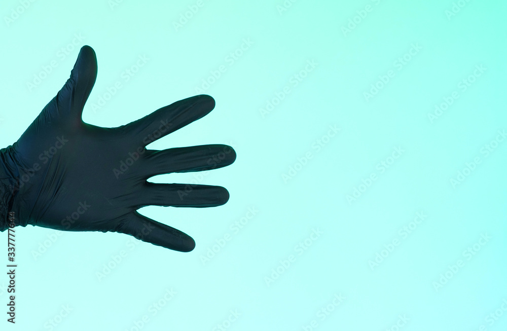 Obraz premium hand in sterile black gloves