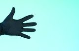 hand in sterile black gloves