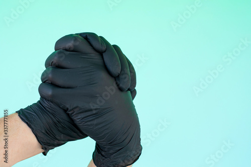hand in sterile black gloves
