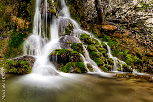 Beautiful Beusnita waterfall in the forest with green moss  Caras Severin county  National Park  Cheile Nerei  Bozovici  Romania