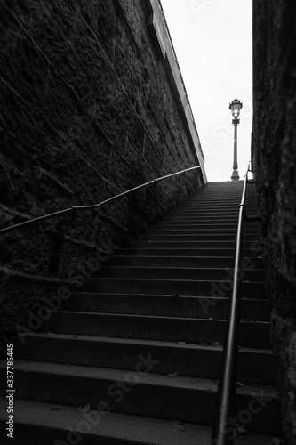 Fototapeta Naklejka Na Ścianę i Meble -  angled black and white shot of ascending stairs