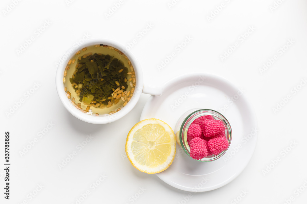 tea with lemon and raspberries on the table tea with lemon and raspberries on the table