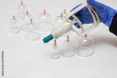 Jars for hijama. Vacuum pumps on a white background