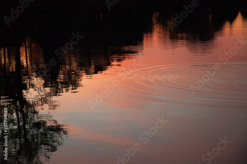 Sunset with ripples, rock throw