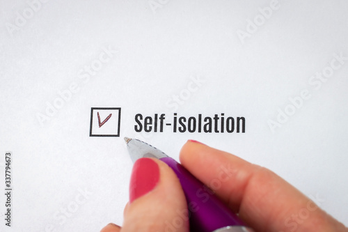 Woman chooses self-isolation. A checkmark in the checkbox is a choice in favor of isolation.